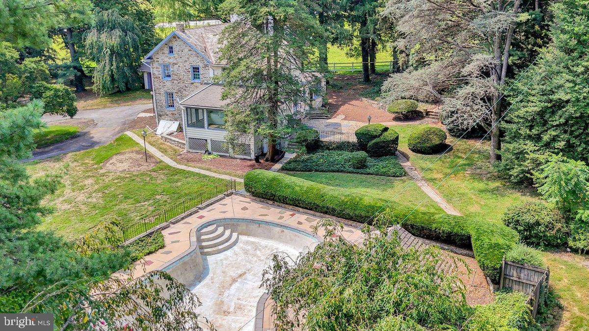284 Old Mill Road Parkesburg, PA 19365 - Photo 46 of 50 a view of a garden with plants and large trees