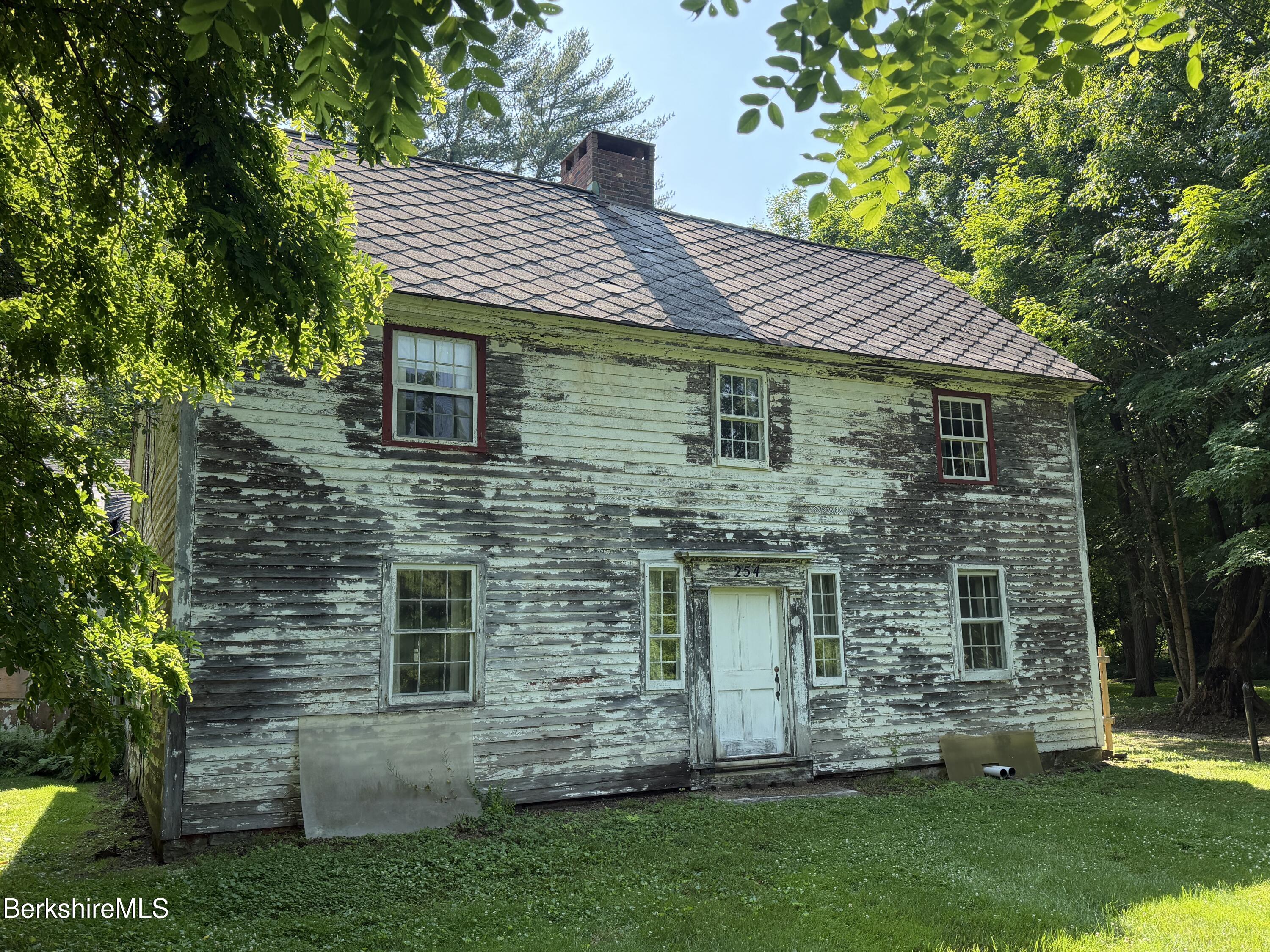 254 Main Street Sheffield, MA 01257 - Photo 1 of 13 a front view of a house with a garden