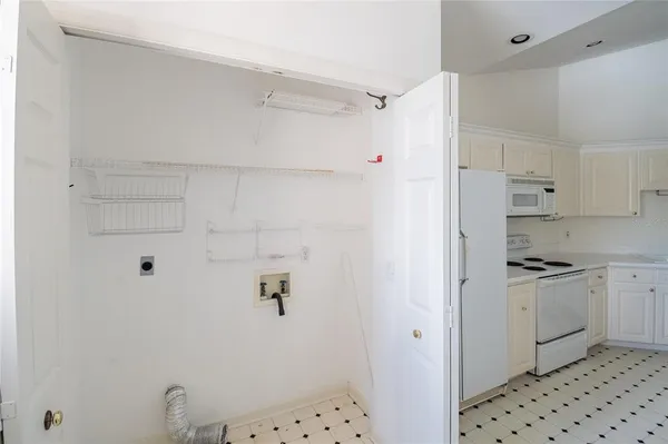 a kitchen with stainless steel appliances a refrigerator and a stove top oven