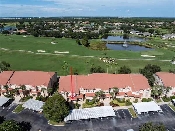 an aerial view of a house with outdoor space and street view
