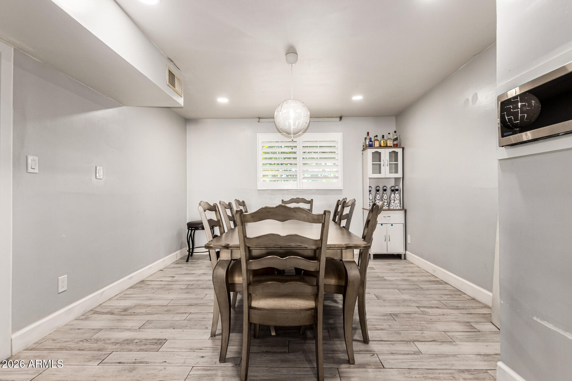 8218 West Osborn Road Phoenix, AZ 85033 - Photo 11 of 27 a view of a dining room with furniture