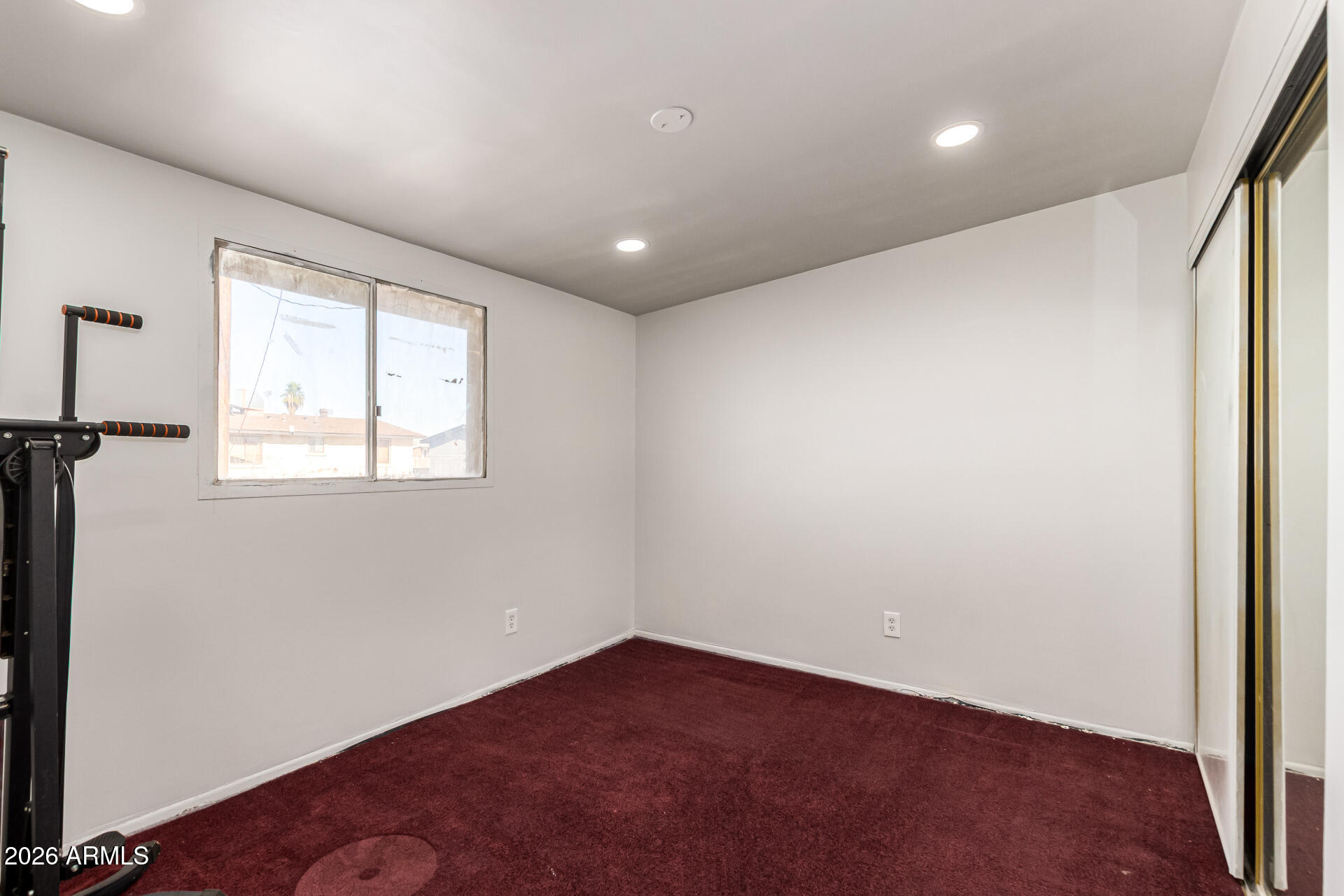 8218 West Osborn Road Phoenix, AZ 85033 - Photo 17 of 27 an empty room with windows