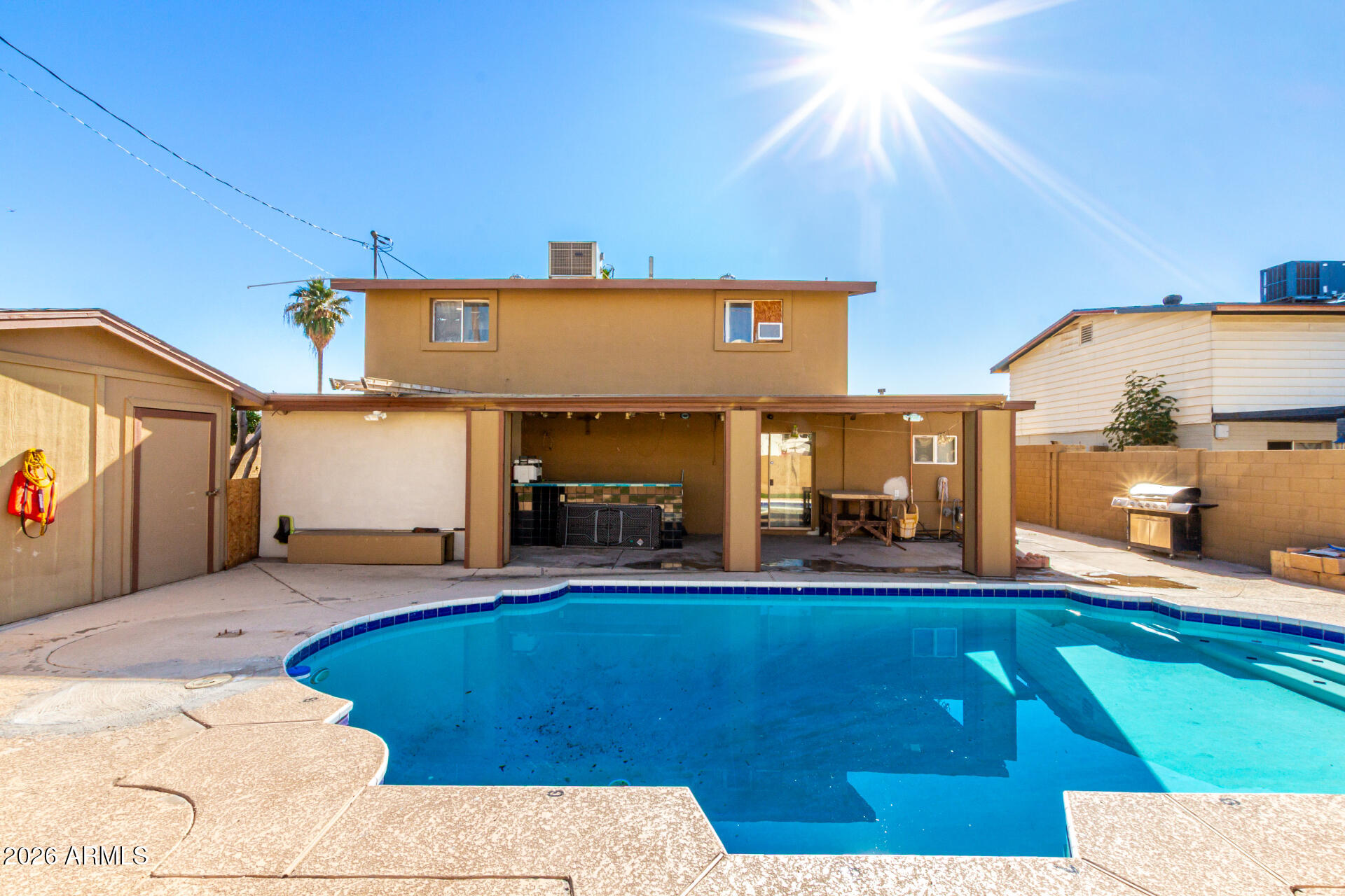 8218 West Osborn Road Phoenix, AZ 85033 - Photo 24 of 27 a view of a kitchen with furniture and a fireplace