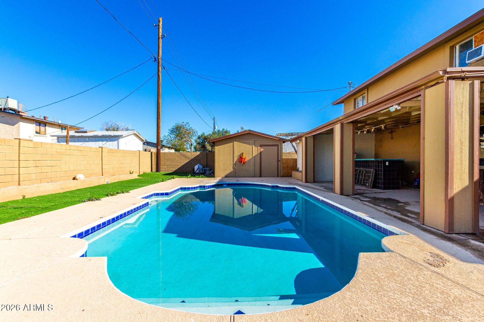 8218 West Osborn Road Phoenix, AZ 85033 - Photo 26 of 27 a view of swimming pool with a lounge chairs