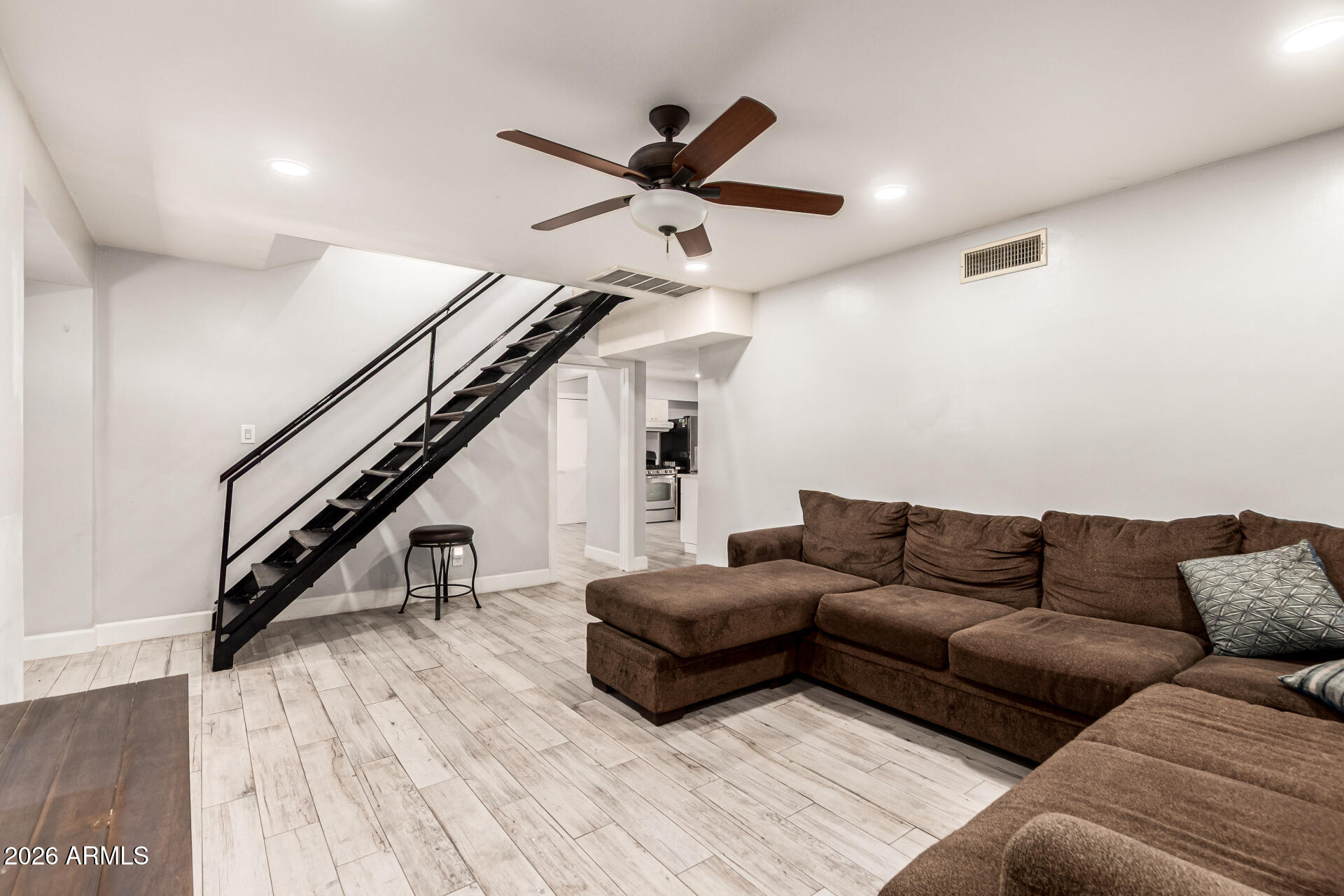 8218 West Osborn Road Phoenix, AZ 85033 - Photo 4 of 27 a living room with furniture and a ceiling fan