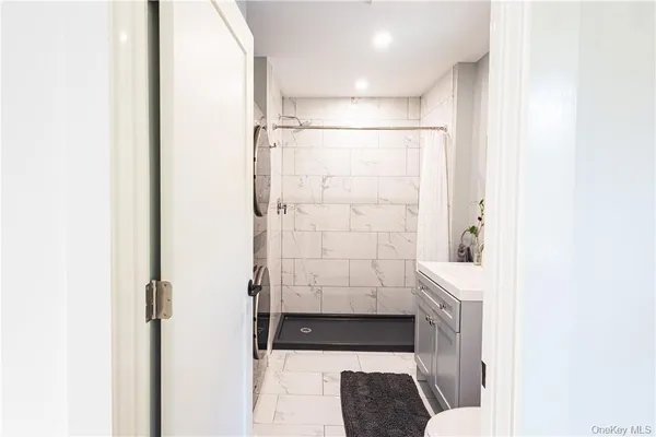 a bathroom with a shower and a toilet