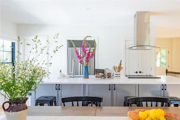 a kitchen with a sink and a potted plant