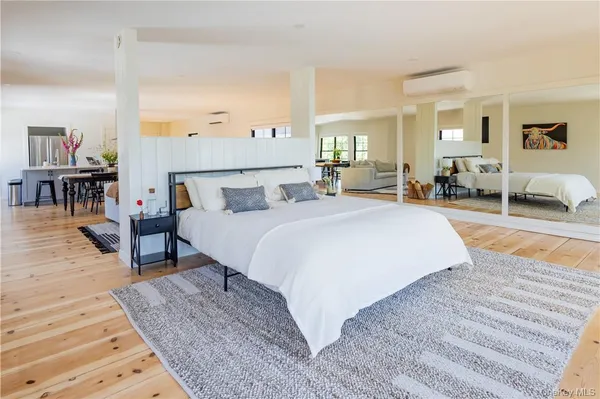 a bedroom with bed and a table