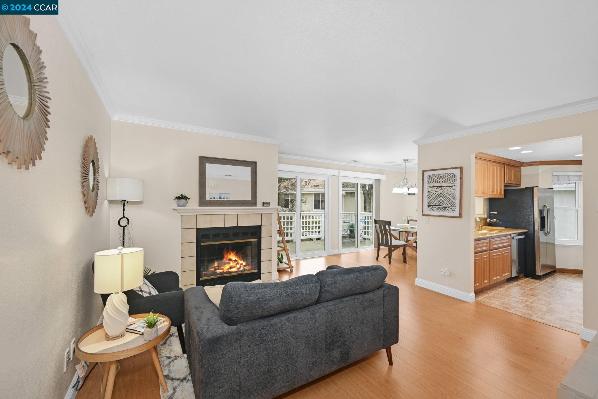 a living room with furniture fireplace and window