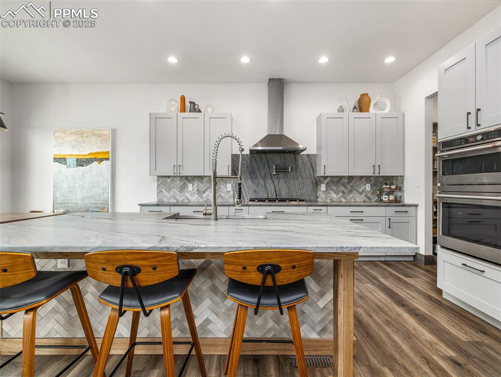 5843 Hart Ranch Drive Beulah, CO 81023 - Photo 11 of 50 a large kitchen with a table and chairs in it