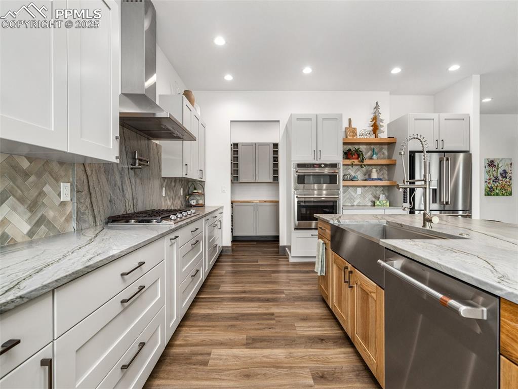 5843 Hart Ranch Drive Beulah, CO 81023 - Photo 14 of 50 a large kitchen with stainless steel appliances kitchen island granite countertop a large counter top and a stove