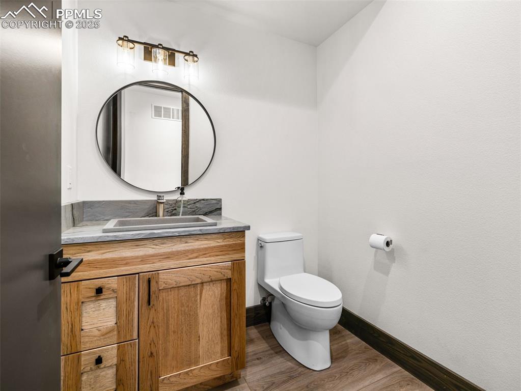 5843 Hart Ranch Drive Beulah, CO 81023 - Photo 22 of 50 a bathroom with a toilet a sink and a mirror