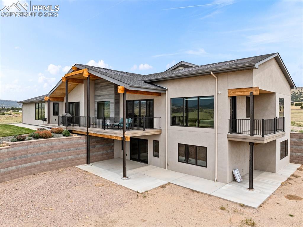 5843 Hart Ranch Drive Beulah, CO 81023 - Photo 36 of 50 a view of a white house with a swimming pool and sitting area