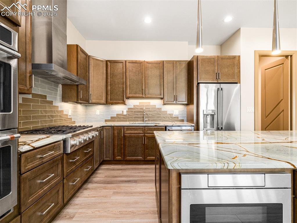 5843 Hart Ranch Drive Beulah, CO 81023 - Photo 40 of 50 a kitchen with stainless steel appliances granite countertop a sink a stove and a refrigerator