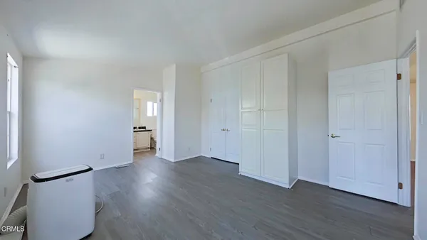 an empty room with wooden floor