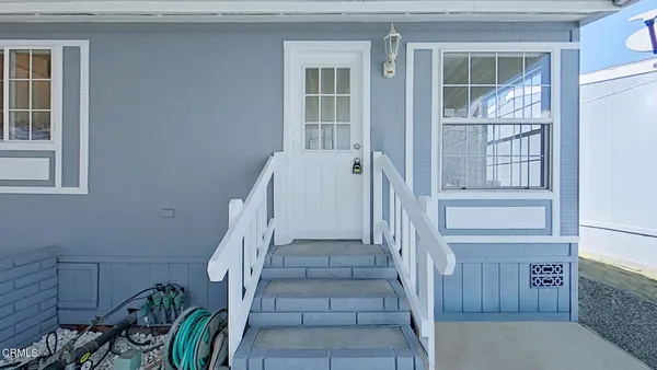 a view of entryway with wooden floor and stairs