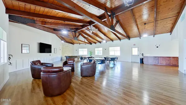 a living room with furniture and flat screen tv