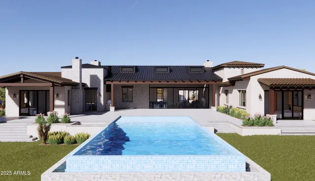 a view of a house with a flower garden