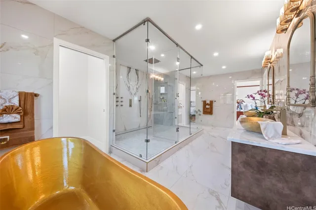 a large kitchen with stainless steel appliances kitchen island granite countertop a refrigerator a sink and a stove