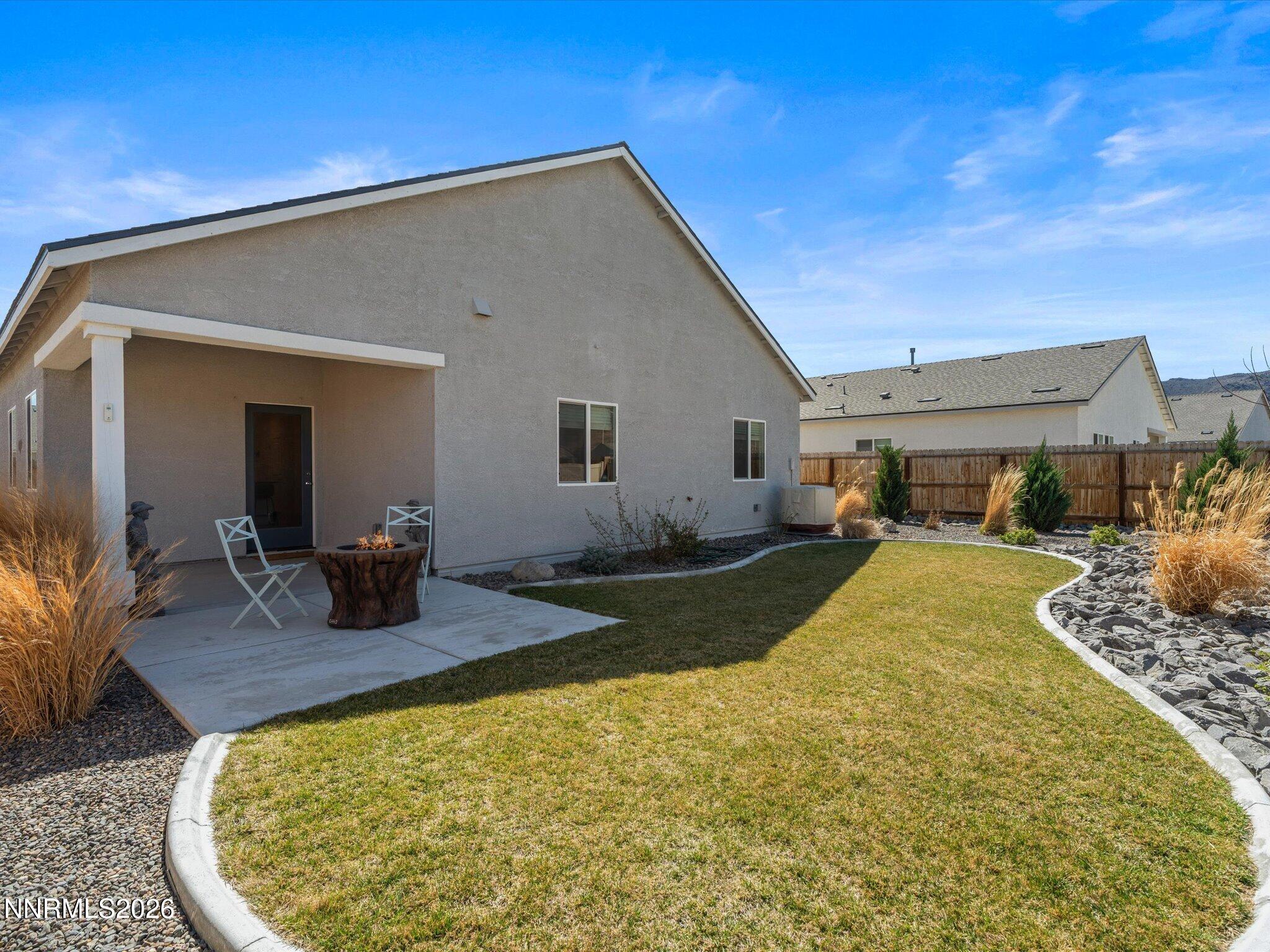 716 Butte Crk Road Dayton, NV 89403 - Photo 1 of 27 a view of a house with backyard and sitting area