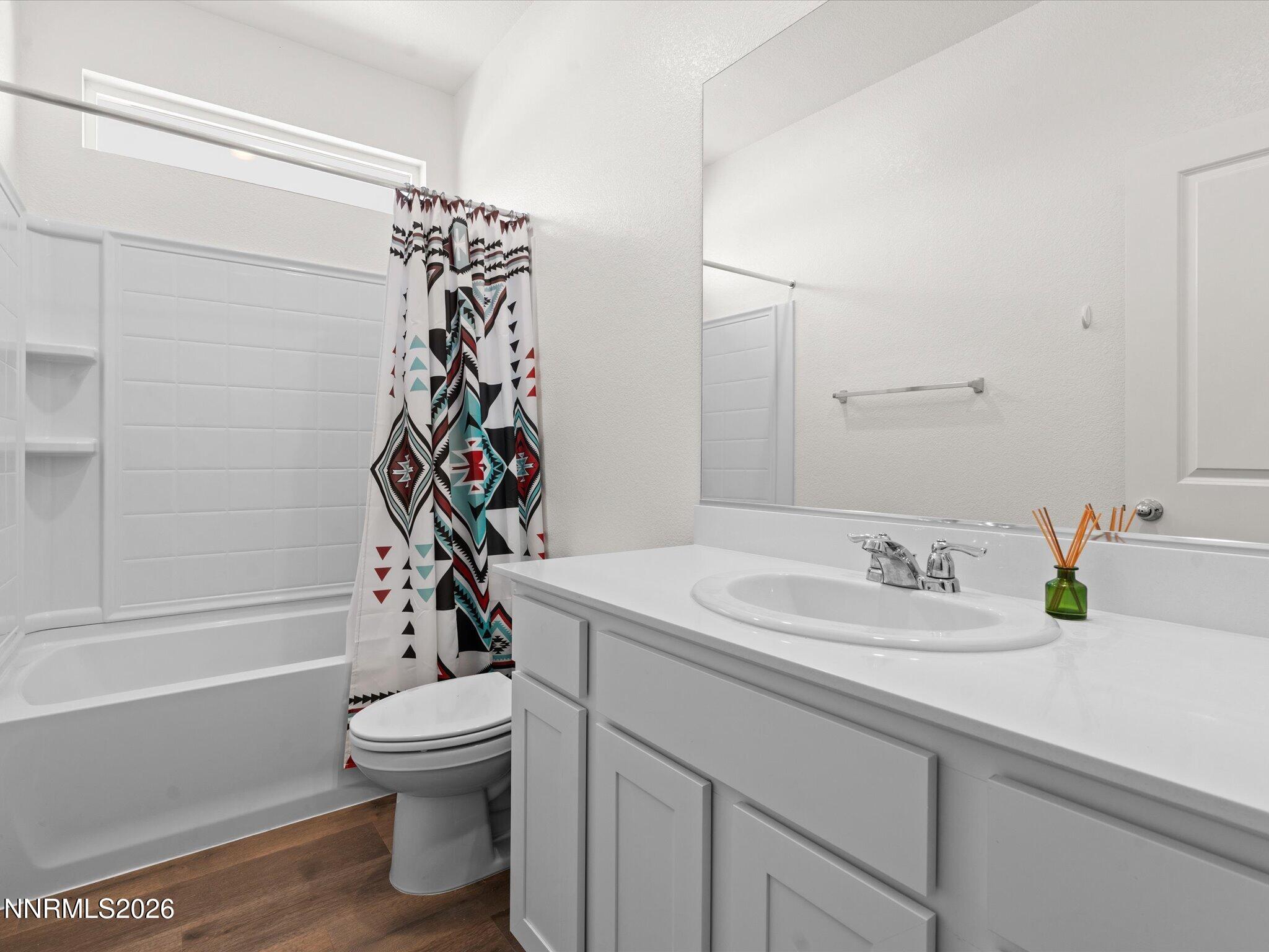 716 Butte Crk Road Dayton, NV 89403 - Photo 18 of 27 a bathroom with a sink a toilet and shower
