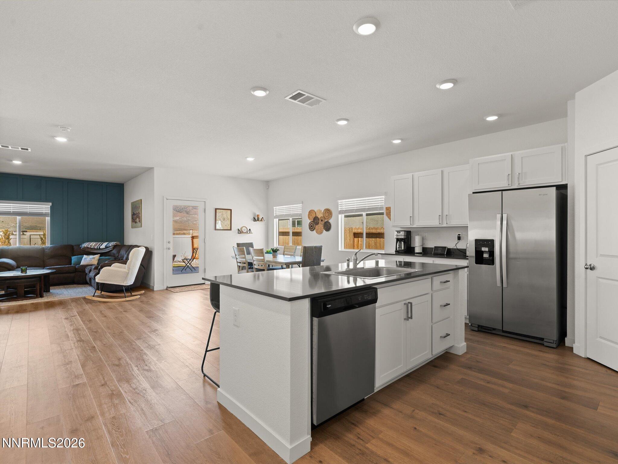 716 Butte Crk Road Dayton, NV 89403 - Photo 6 of 27 a kitchen with sink refrigerator and cabinets