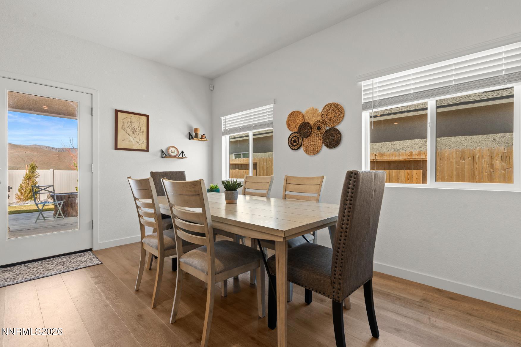 716 Butte Crk Road Dayton, NV 89403 - Photo 9 of 27 a view of a dining room with furniture and wooden floor