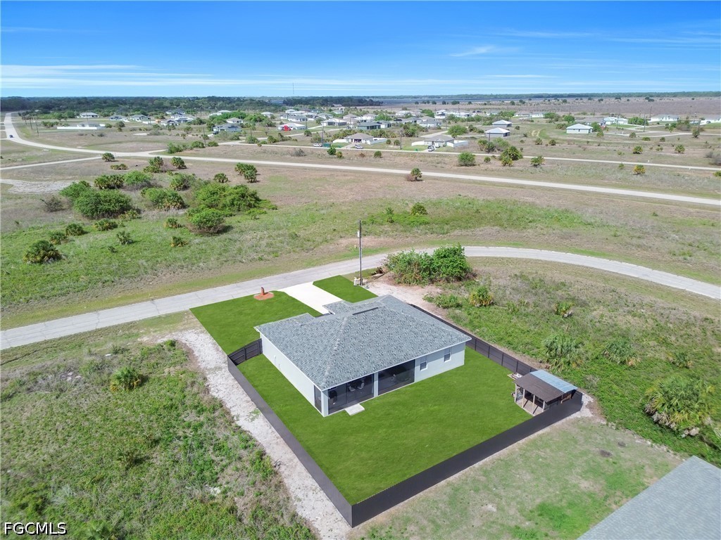 384 Neighborly Road LaBelle, FL 33935 - Photo 37 of 45 a view of a yard with an outdoor seating