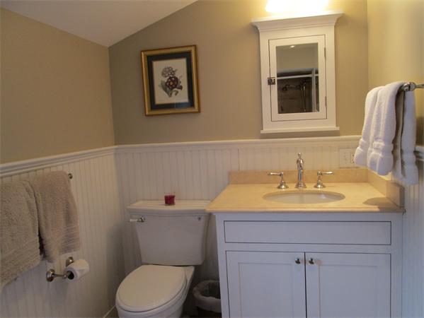 42 Topsfield Road Boxford, MA 01921 - Photo 20 of 30 a bathroom with a sink a toilet and mirror