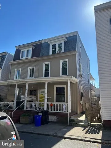 a front view of a house with outdoor space