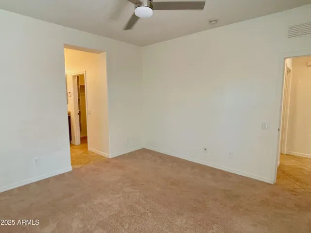 an empty room with a empty space and a window