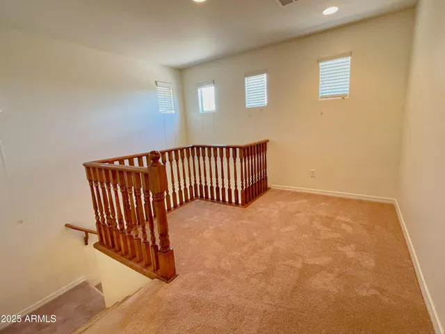 a view of a hallway with staircase