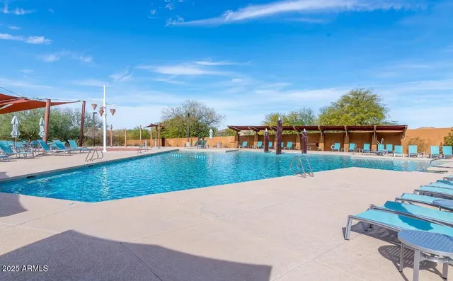 a view of swimming pool with a yard