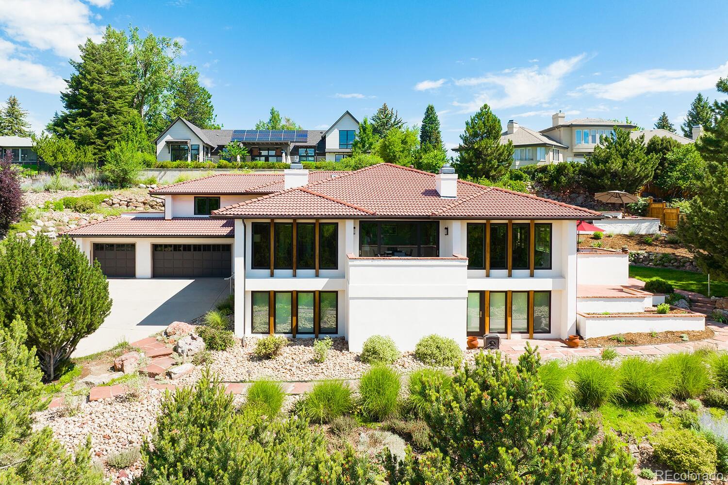 a front view of a house with a yard table and chairs