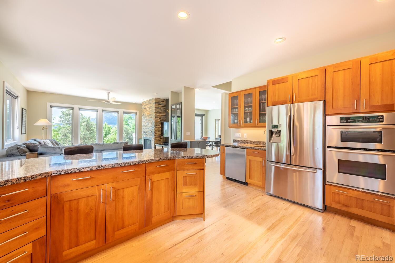 3828 Cloverleaf Drive Boulder, CO 80304 - Photo 12 of 40 a large kitchen with a large window and stainless steel appliances