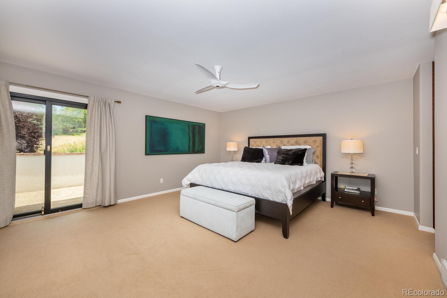 3828 Cloverleaf Drive Boulder, CO 80304 - Photo 15 of 40 a bedroom with a bed and a tv