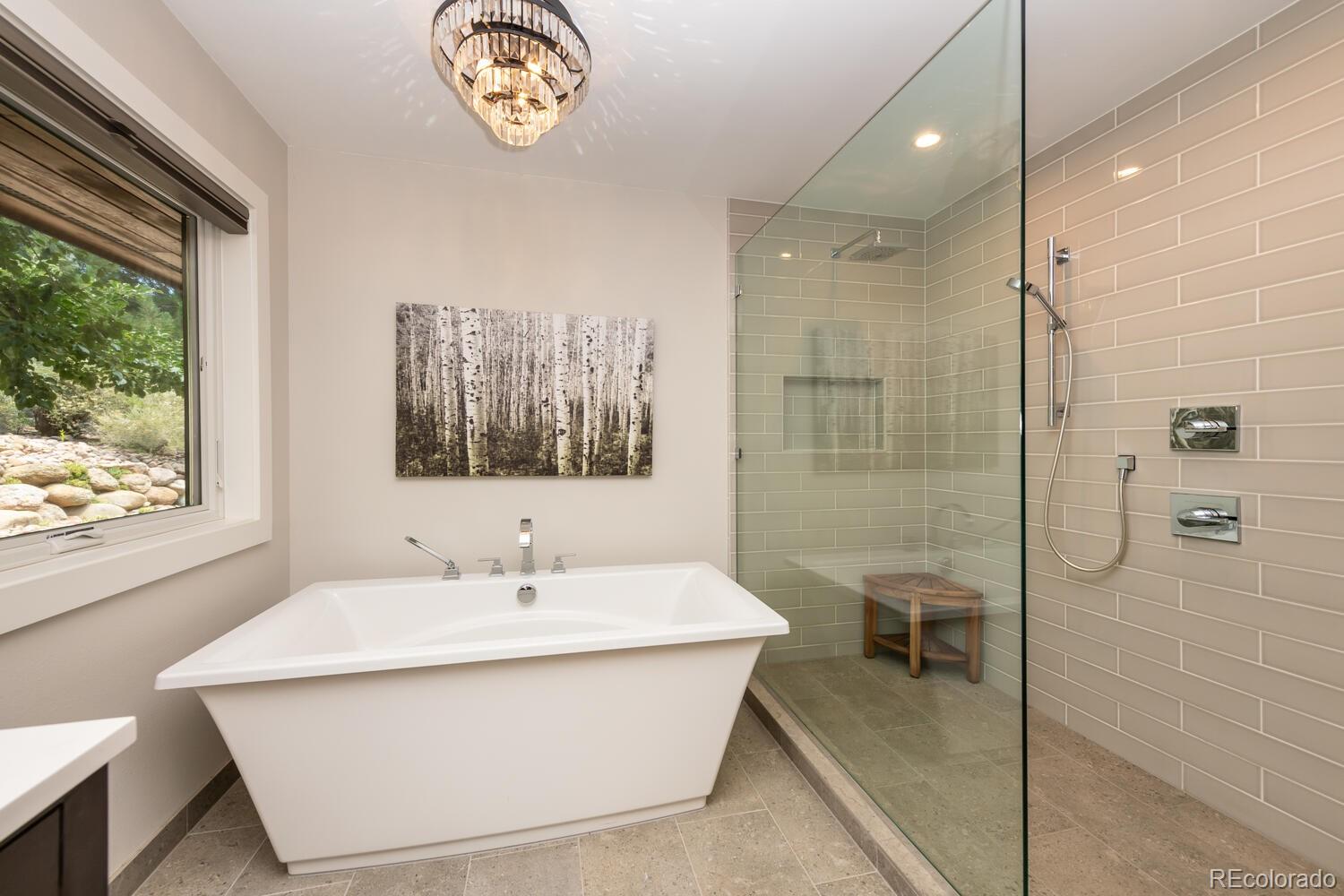 3828 Cloverleaf Drive Boulder, CO 80304 - Photo 18 of 40 a bathroom with a sink a toilet a large mirror and shower
