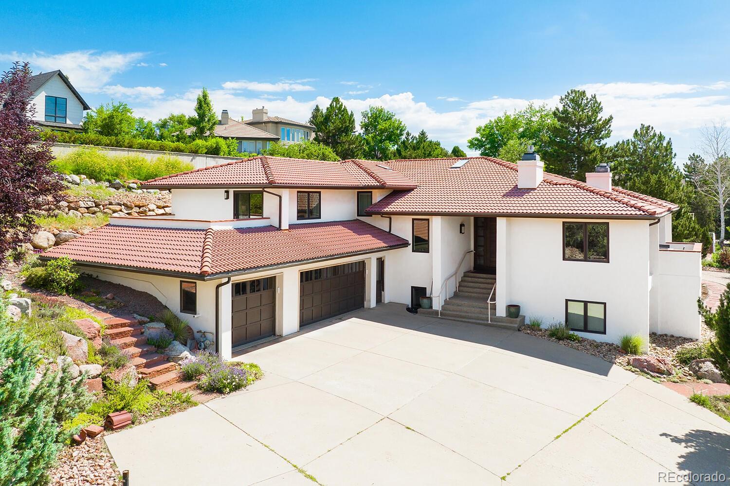 3828 Cloverleaf Drive Boulder, CO 80304 - Photo 2 of 40 a front view of a house with a garden
