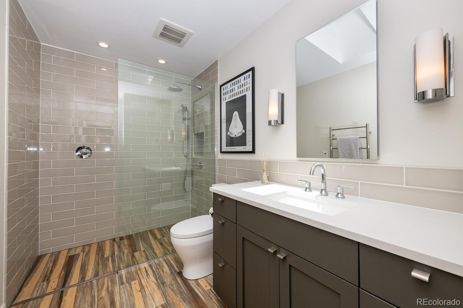 3828 Cloverleaf Drive Boulder, CO 80304 - Photo 21 of 40 a bathroom with a sink a toilet and shower