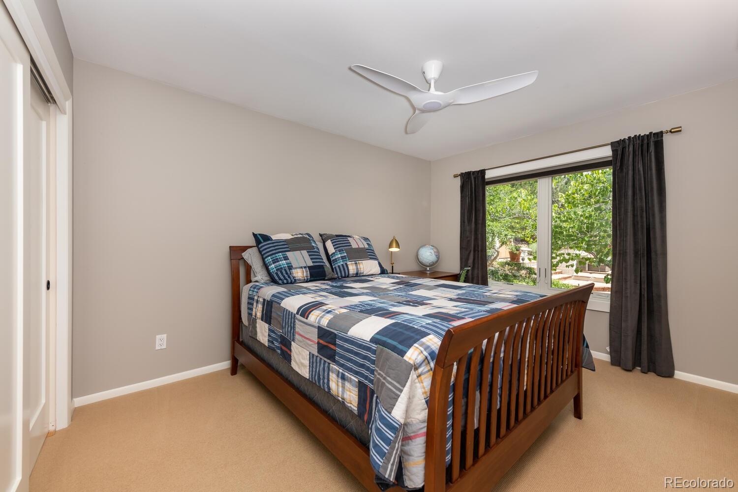 3828 Cloverleaf Drive Boulder, CO 80304 - Photo 22 of 40 a bedroom with a bed and window