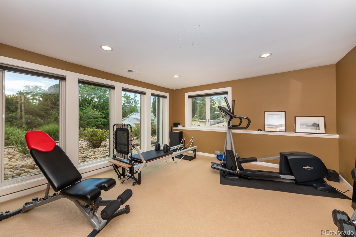 3828 Cloverleaf Drive Boulder, CO 80304 - Photo 31 of 40 a room with gym equipment and a large window