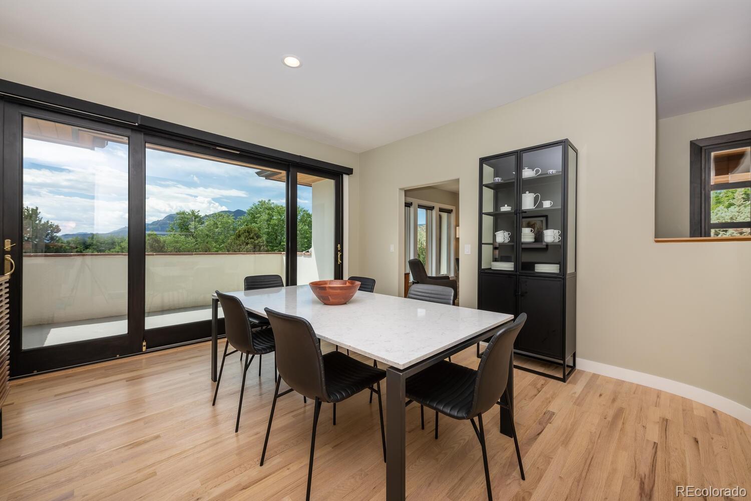 3828 Cloverleaf Drive Boulder, CO 80304 - Photo 9 of 40 a view of a dining room with furniture window and wooden floor