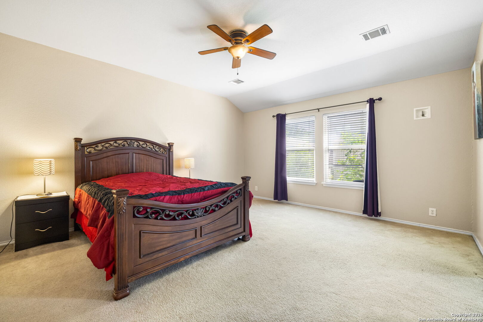 6522 Charles Field Leon Valley, TX 78238 - Photo 14 of 30 a spacious bedroom with a bed and window