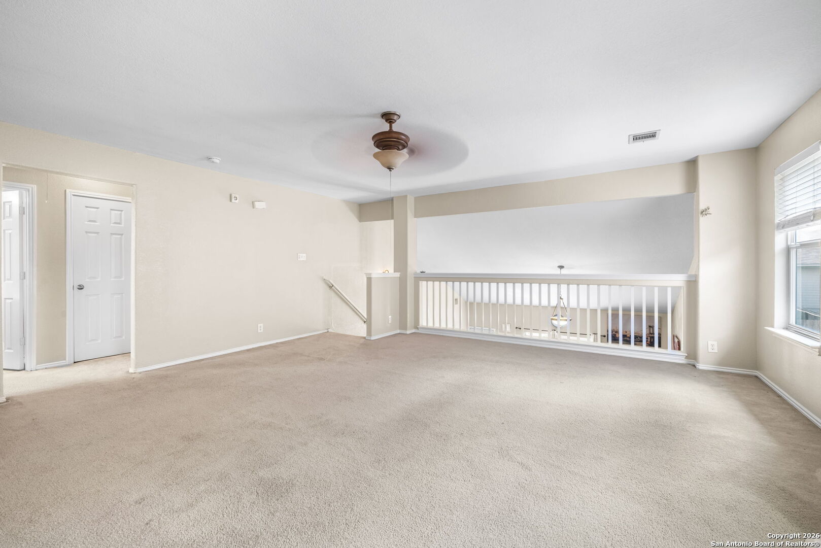 6522 Charles Field Leon Valley, TX 78238 - Photo 20 of 30 a view of an empty room with a window