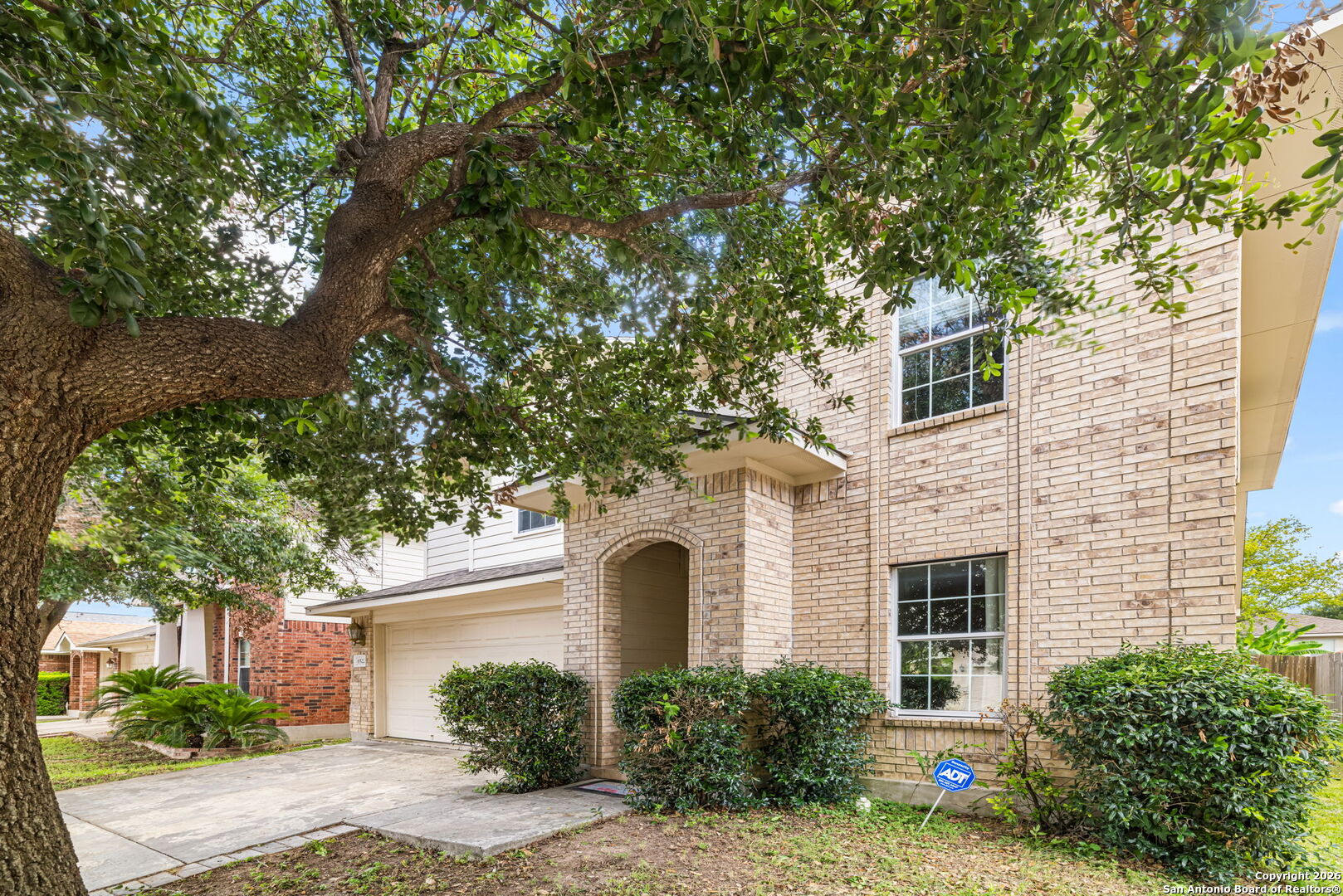 6522 Charles Field Leon Valley, TX 78238 - Photo 2 of 30 a front view of a house with garden