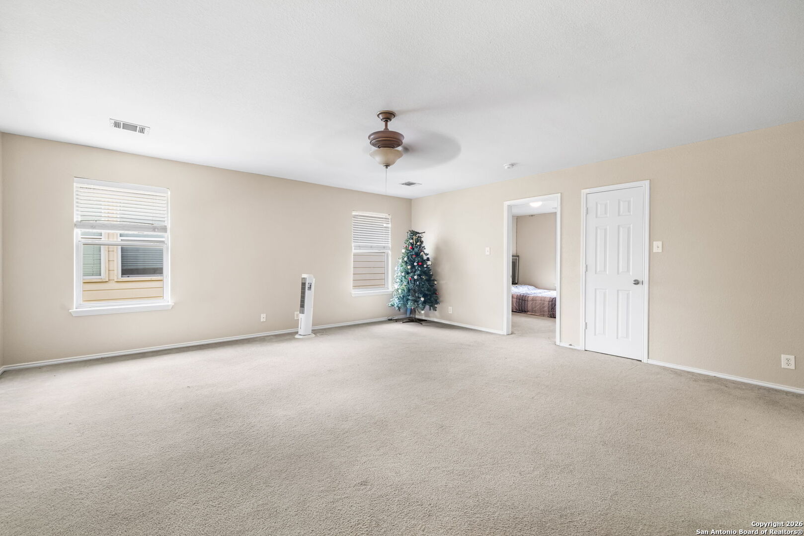 6522 Charles Field Leon Valley, TX 78238 - Photo 22 of 30 a view of an empty room with a window