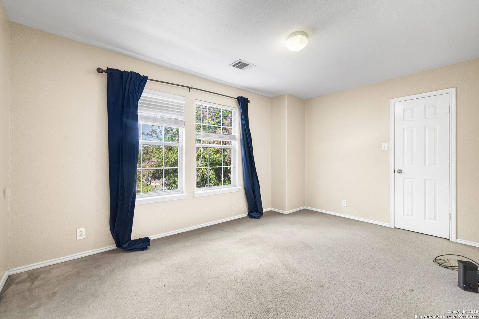 6522 Charles Field Leon Valley, TX 78238 - Photo 26 of 30 an empty room with windows