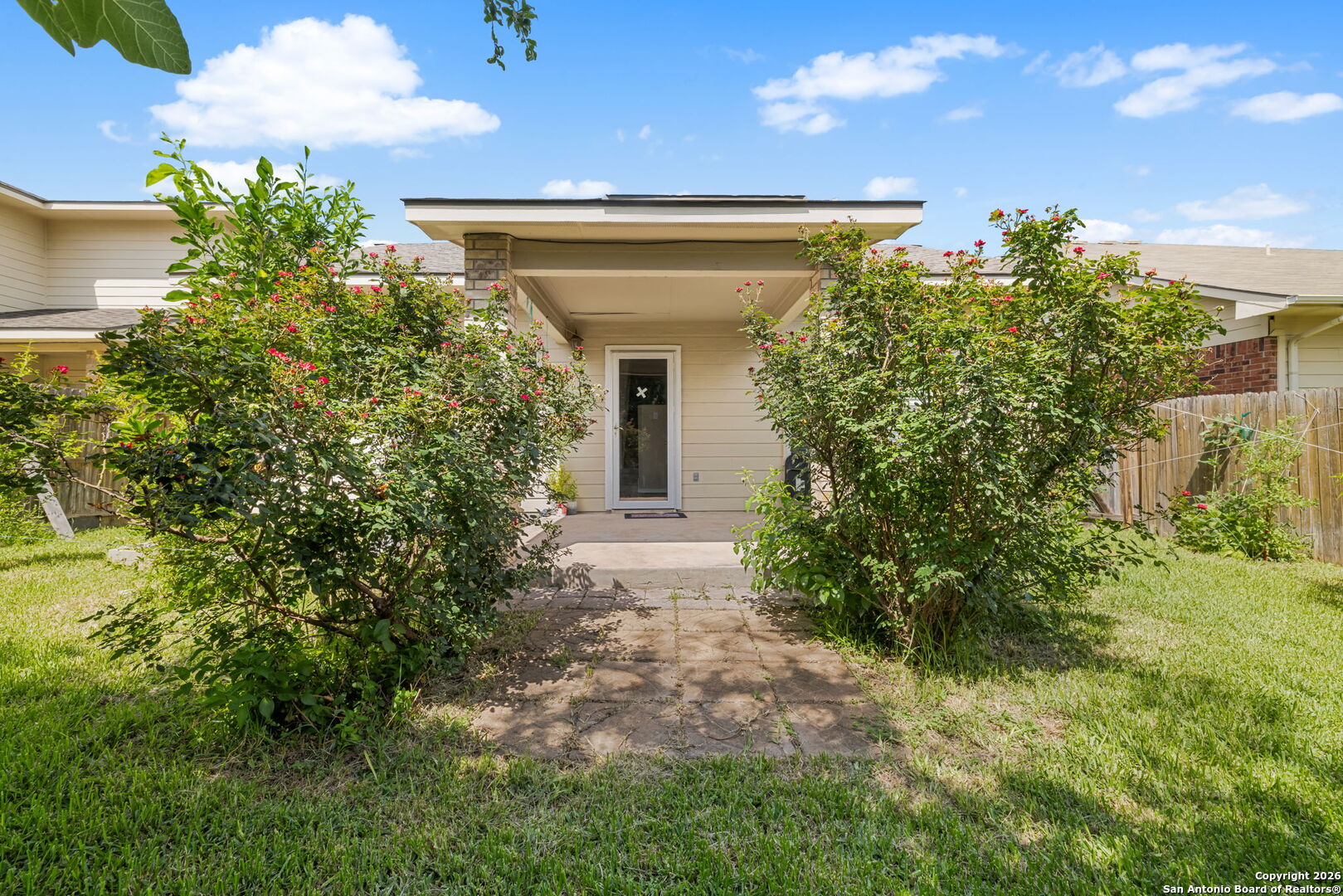 6522 Charles Field Leon Valley, TX 78238 - Photo 29 of 30 a view of a house with plants and a tree