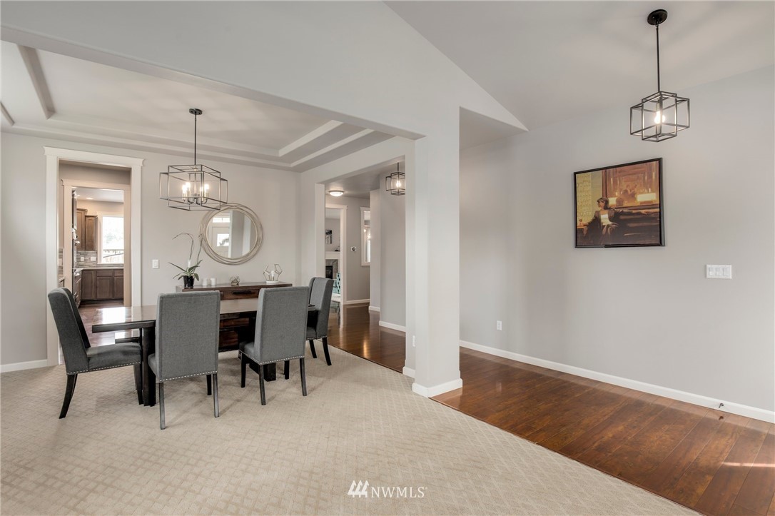 5805 Parker Road East Sumner, WA 98390 - Photo 6 of 40 a view of a dining room with furniture and wooden floor
