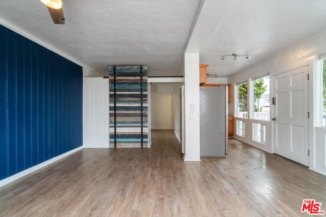 115 44th Street Manhattan Beach, CA 90266 - Photo 18 of 38 an empty room with wooden floor closet and windows
